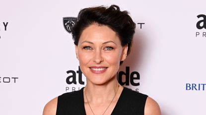 Image of Emma Willis smiling with brunette pixie cut and wearing a black waistcoat, with a white background with text on it