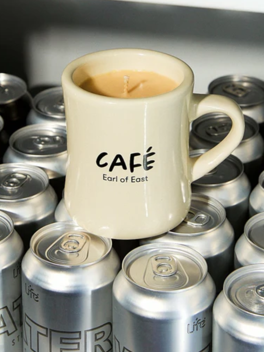 An americano scented candle in a ceramic mug from Earl of East
