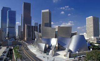 An icon of the Los Angeles skyline, the Walt Disney Concert Hall. A large silver building made of rounded structures.