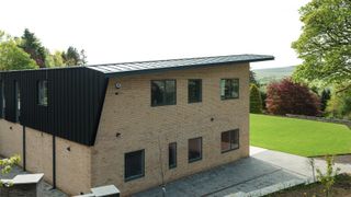 large SIPs home with brick slip cladding