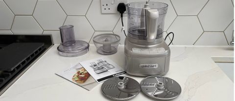 The Cuisinart Easy Prep Pro FP8 on a kitchen countertop with all its accesories