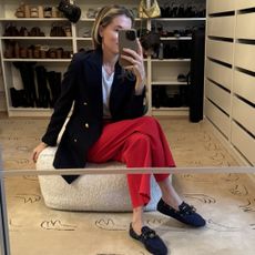 Marina Larroudé wearing red jeans