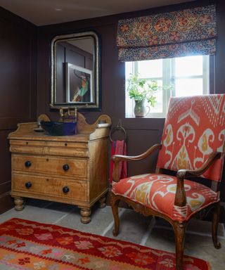 A colorful cloakroom in a country home in Sussex designed by Kate Forman