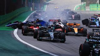 Alexander Albon of Thailand driving the (23) Williams FW45 Mercedes and Kevin Magnussen of Denmark driving the (20) Haas F1 VF-23 Ferrari (obscured) ahead of the Las Vegas Grand Prix 2023 