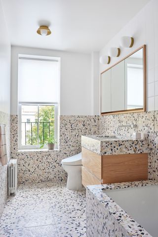 a bathroom with terrazzo tiles