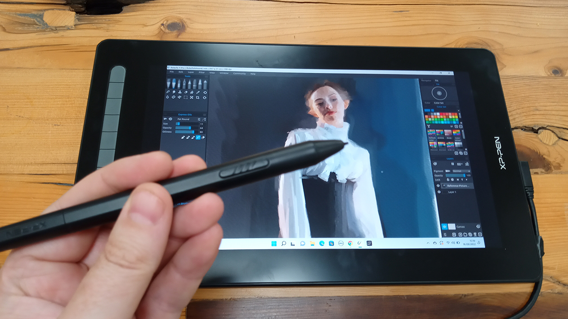 XP-Pen Artist 16 (2nd gen) review; a photo of a hand holding a stylus