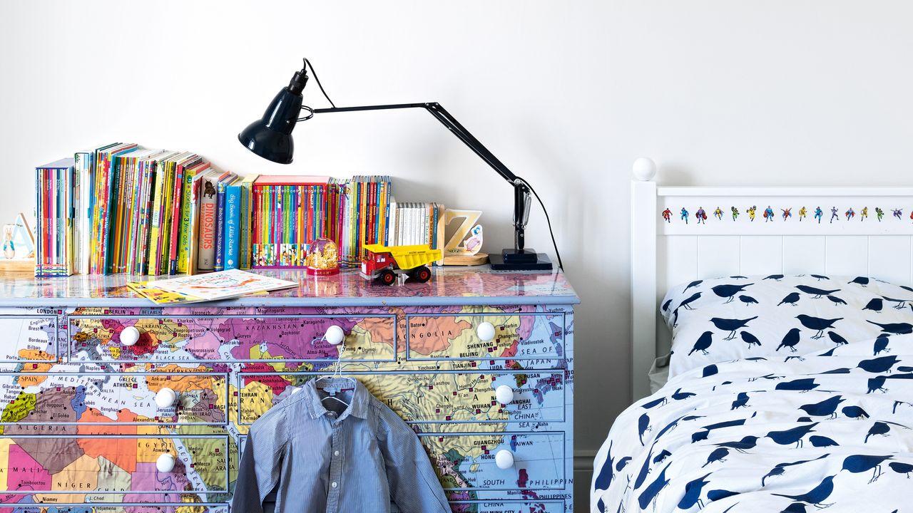 Boys bedroom with drawers covered in maps