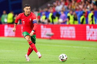 Cristiano Ronaldo of Portugal runs with the ball during the Round of 16 - UEFA EURO 2024 match between Portugal and Slovenia at Deutsche Bank Park on July 1, 2024 in Frankfurt, Germany. (Photo by Peter Lous/BSR Agency/Getty Images)