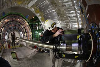 Engineers work on one of the CMS detectors during the scheduled two-year shutdown of the LHC.