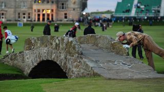 Tom Watson kisses the Swilcan Bridge during the 2010 Open