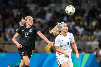 Hannah Wilkinson, left, of New Zealand and Julie Johnston of Team USA.