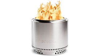 Stainless steel solo stove bonfire on a white background with fire coming out of the top.
