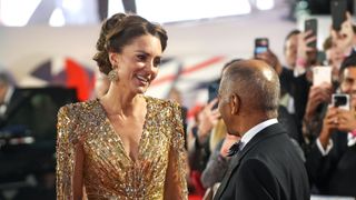 Kate Middleton shaking hands with Sir Kenneth Olisa