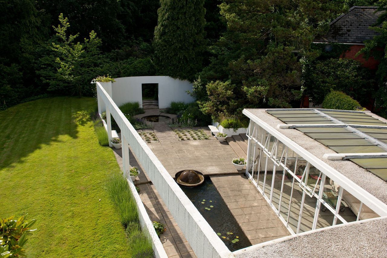 A view from the balcony show the top of the conservatory and a separate terraced area