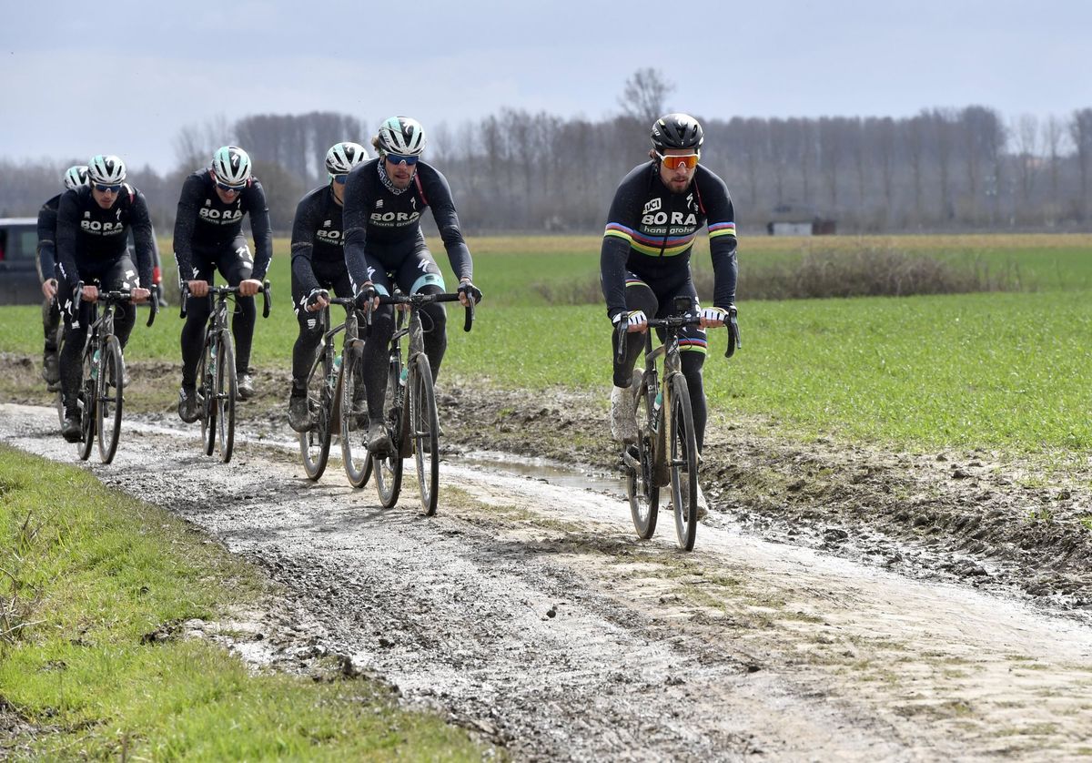 Peter Sagan and Bora-Hansgrohe teammates tests the muddy pav&eacute; of Paris-Roubaix