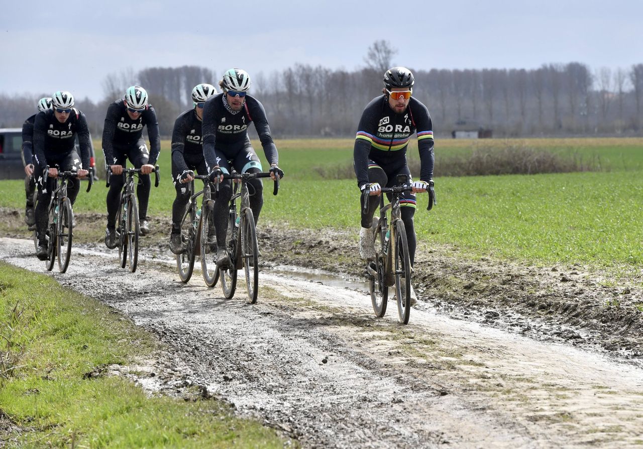 Peter Sagan and Bora-Hansgrohe teammates tests the muddy pav&eacute; of Paris-Roubaix