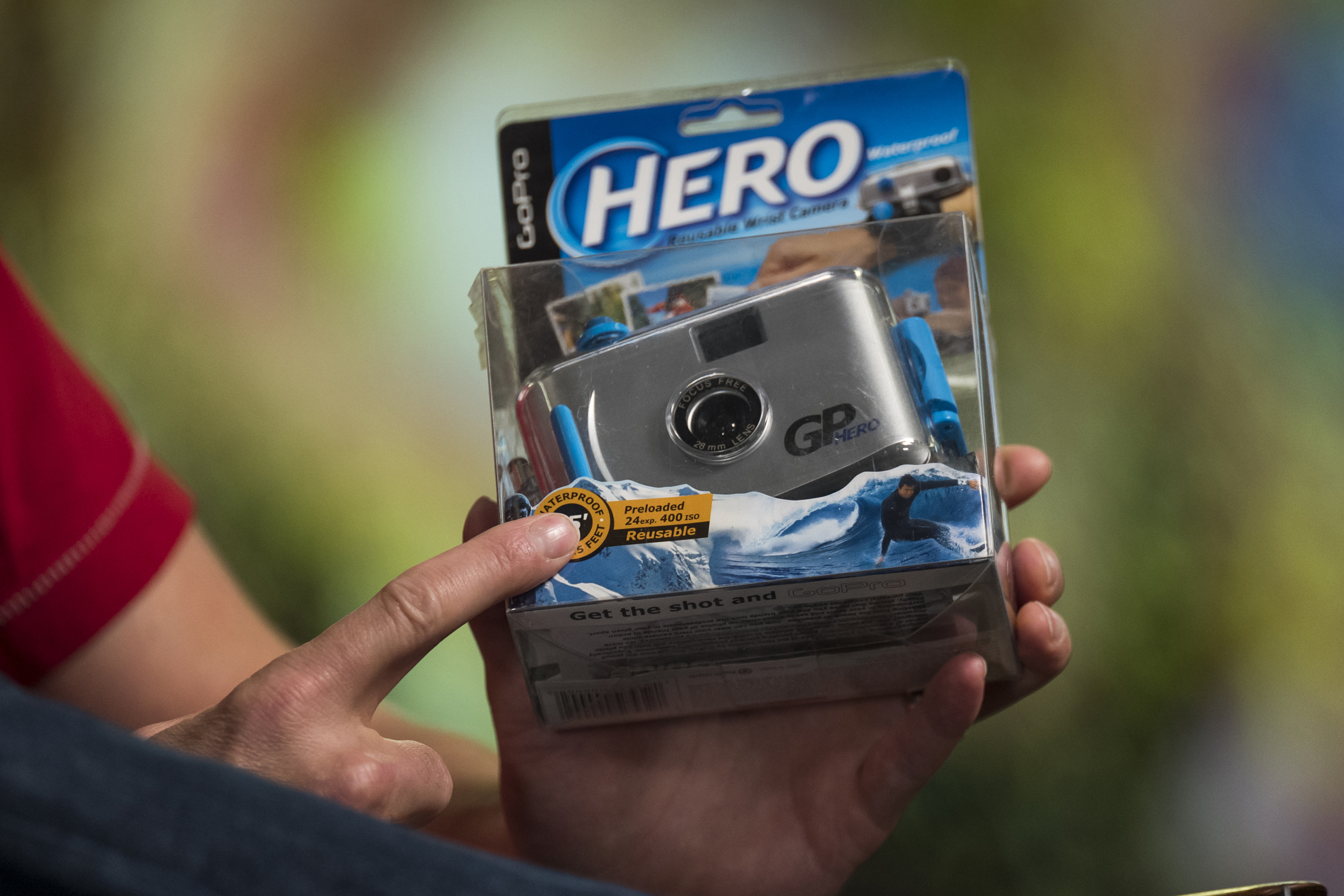 Nick Woodman, founder and chief executive officer of GoPro Inc., holds the original GoPro Hero action camera during a Bloomberg Studio 1.0 television interview at the company's headquarters, 2019