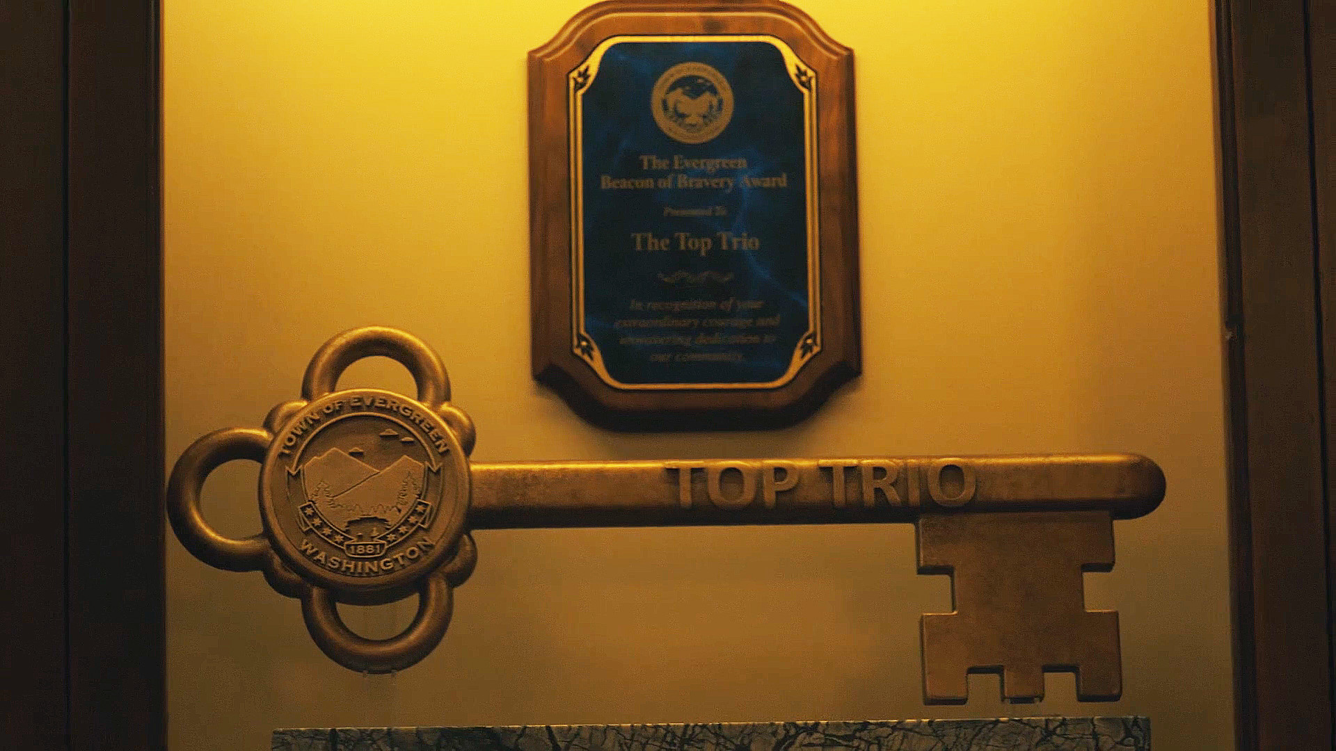 An image of an honorary key to the city of Evergreen in Peacemaker season 2 episode 1