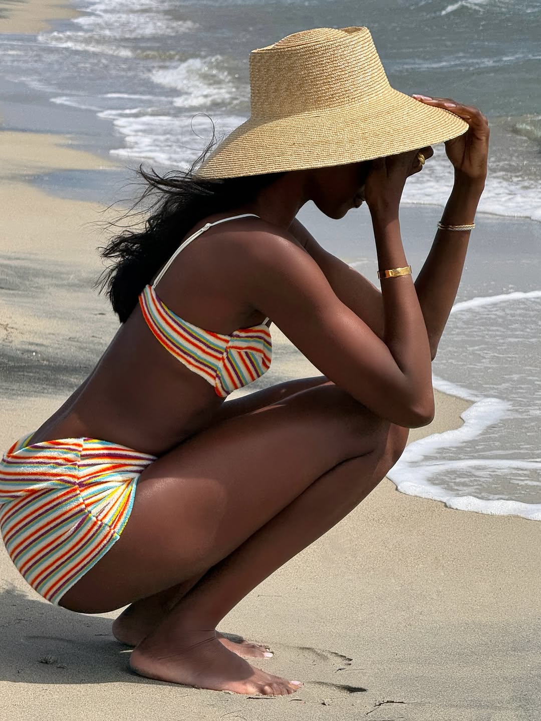 Emmanuelle Koffi wears a multicolored set from Triangl in San Cataldo, Italy