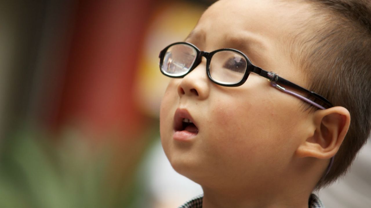 child with glasses