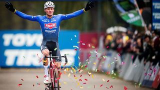 Mathieu van der Poel celebrates winning a cyclocross race in Antwerp