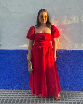 Woman wearing a red dress from Reformation