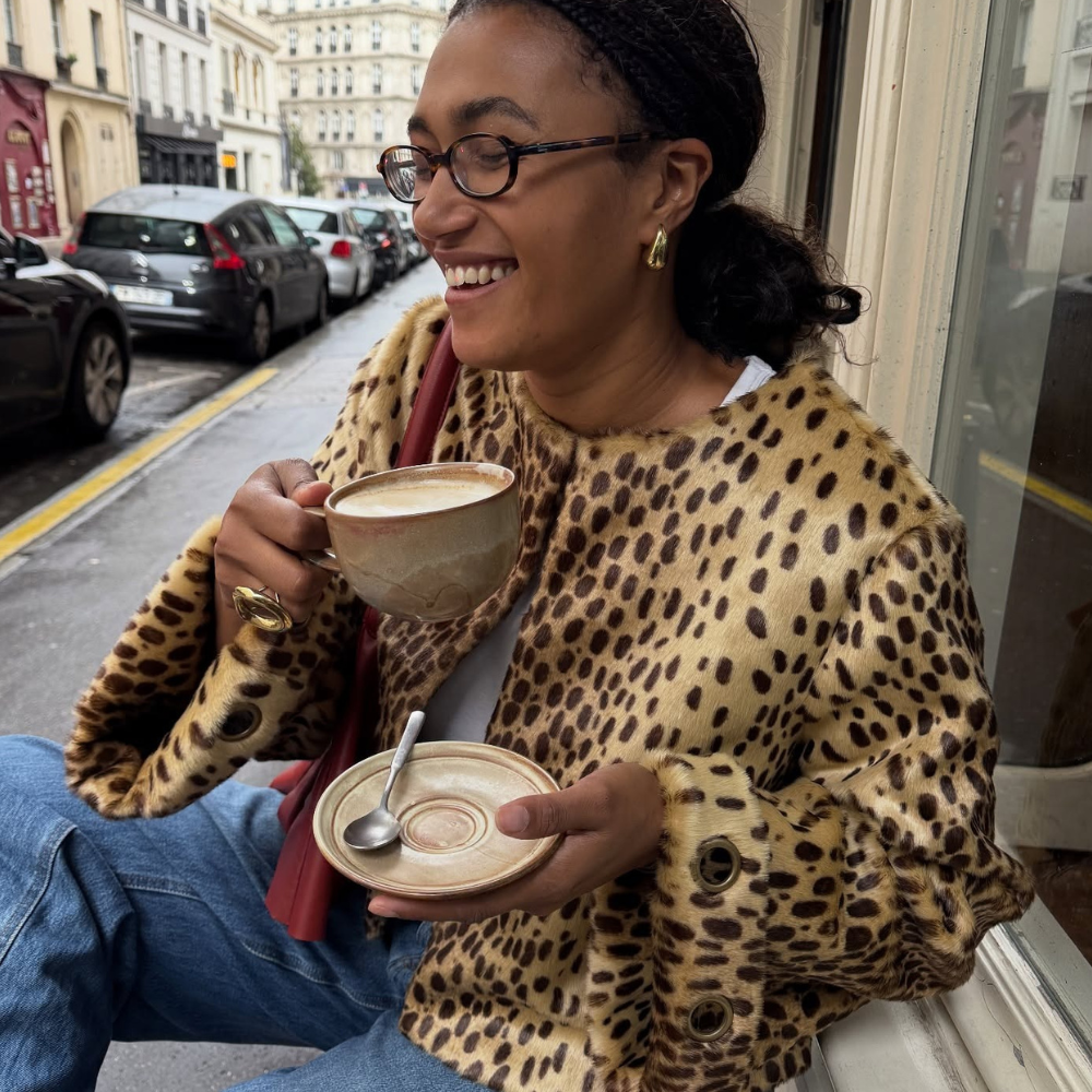 Fashion person Lena Farl wears the cropped leopard print coat trend.