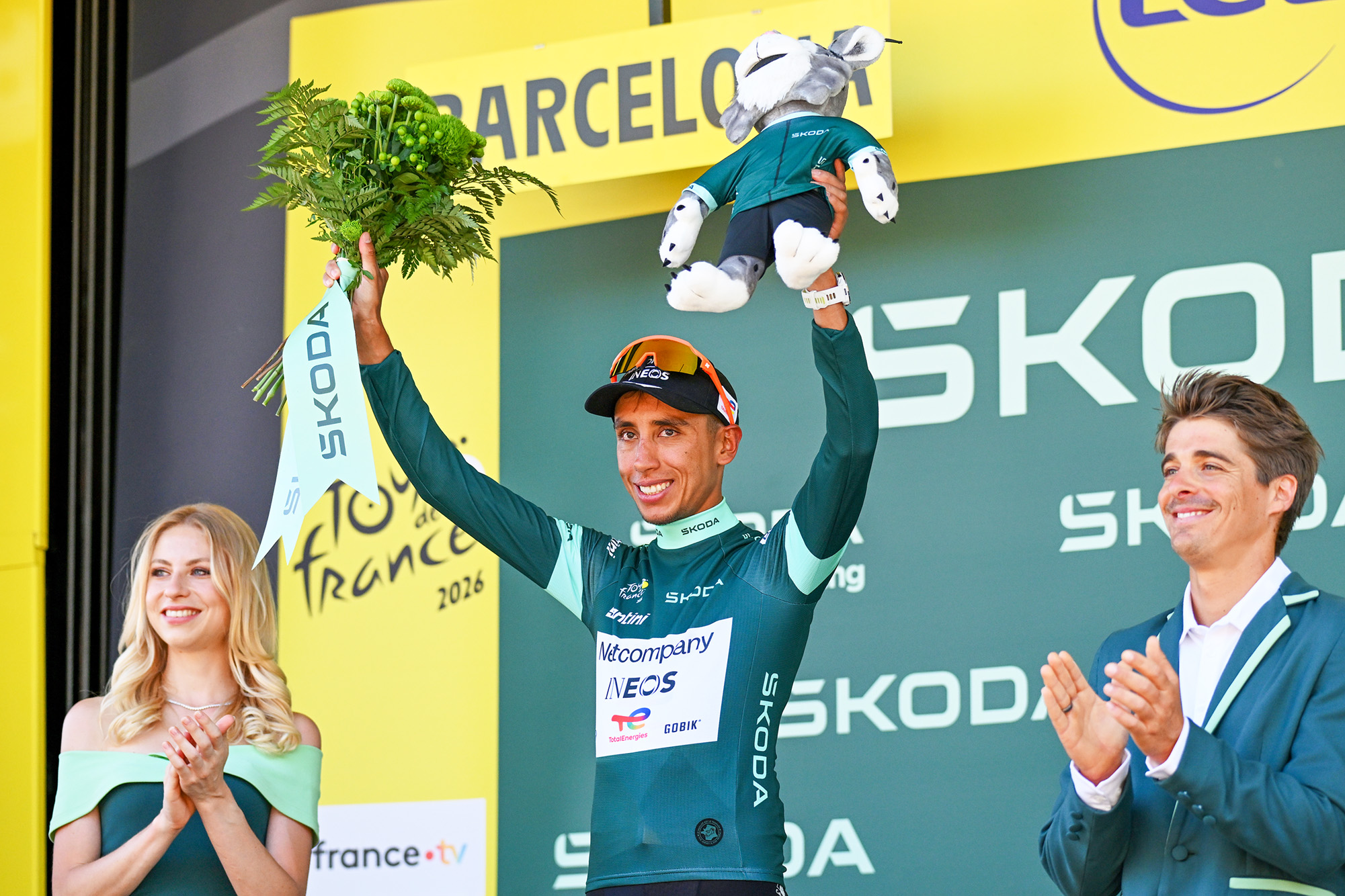 Netcompany Ineos rider Egan Bernal celebrates on the podium in the green jersey after stage 1 of the 2026 Tour de France in Barcelona