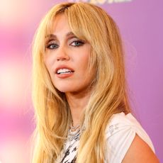 Miley Cyrus attended the premiere of 'Hannah Montana the 20th Anniversary Special' in a Hannah Montana T-shirt and a custom Rabanne dress