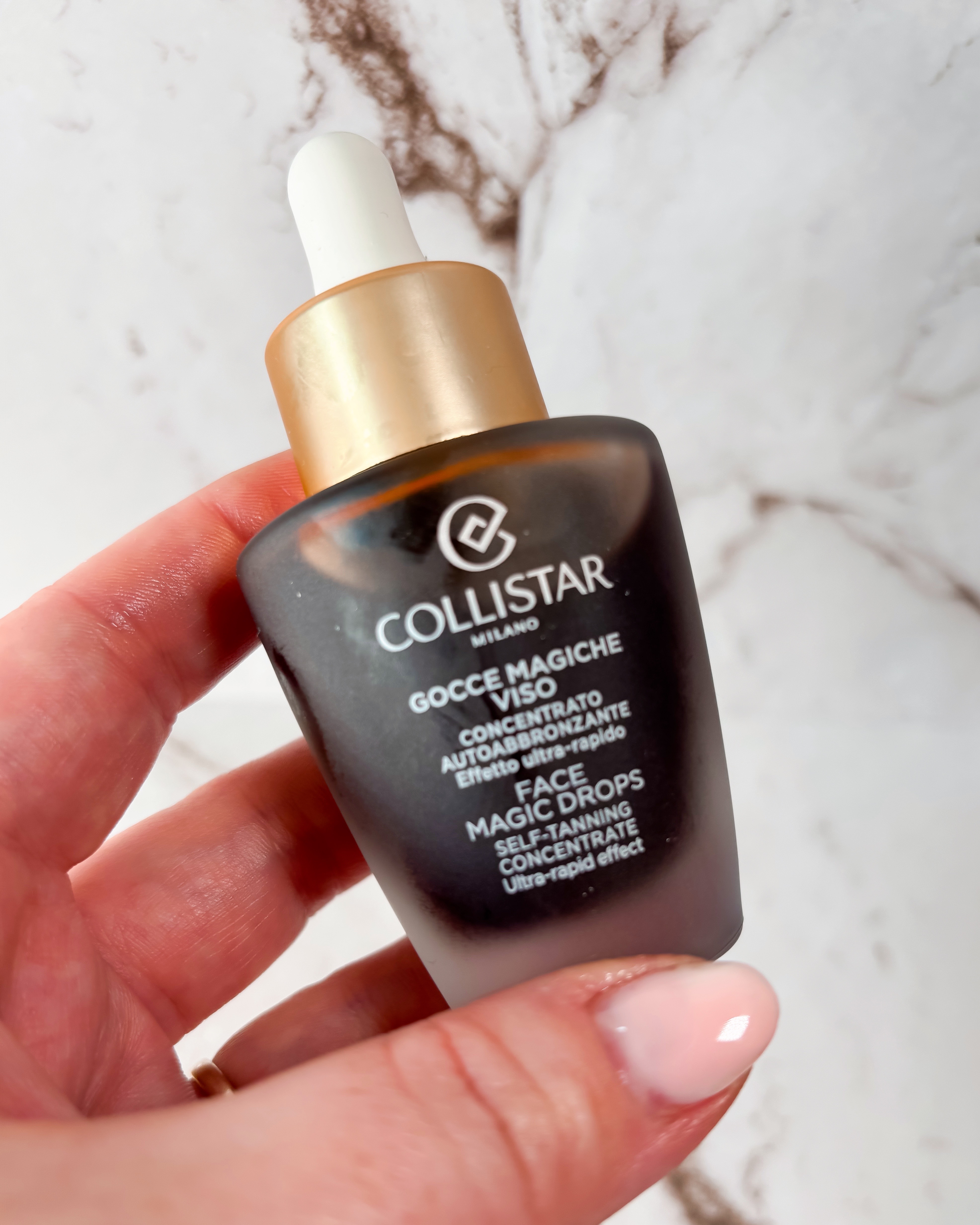 A photo of Collistar Tanning Drops against a marble background