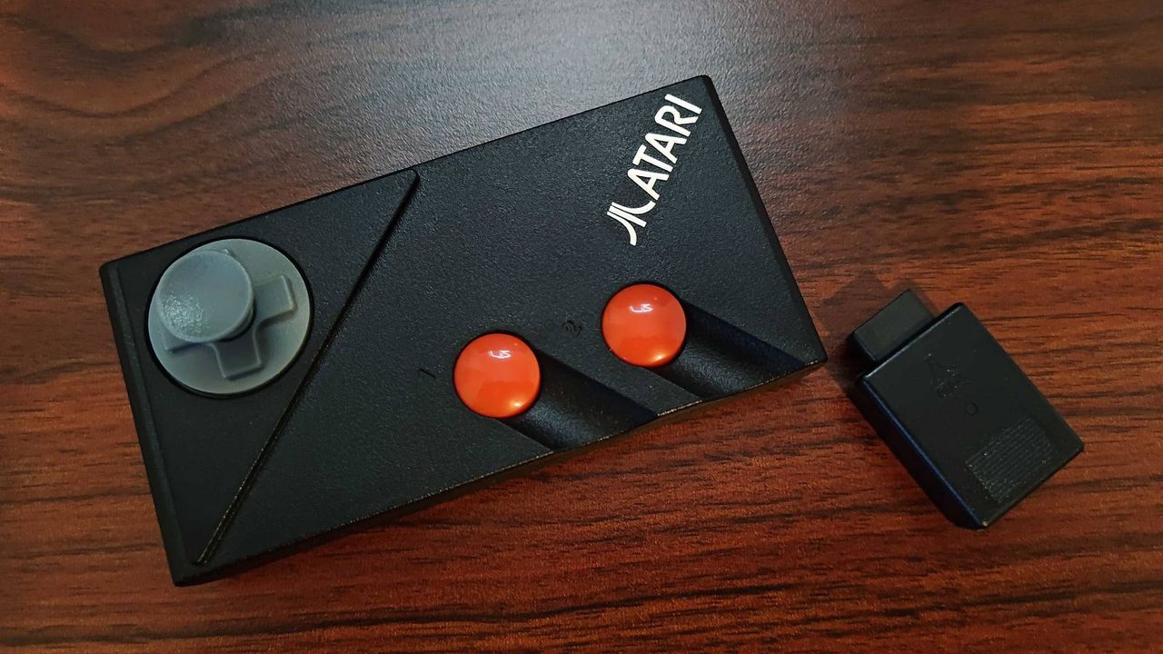 Close up of Atari 7800+ wireless gamepad on desk