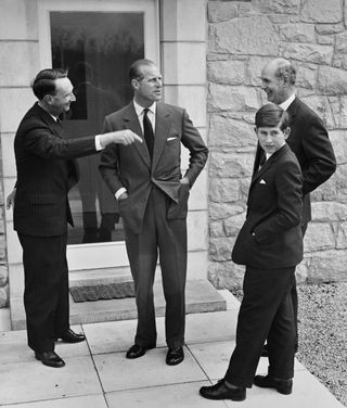 Prince Charles and Duke of Edinburgh with House Master Robert Whitby and, on right, Headmaster Robert Chew during a tour of the grounds of Gordonstoun boarding school in Moray, Scotland on 1st May 1962