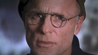 Ed Harris talks into the camera in The Truman Show.