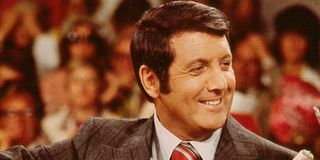 Let's Make A Deal Monty Hall smiling and dealing