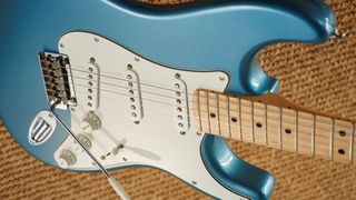 Tidepool Fender Player strat on light brown carpet