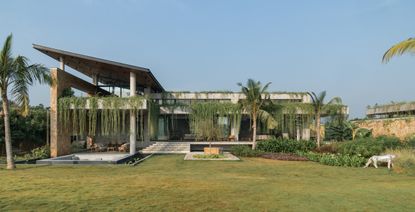 hyderabad home in brutalist style covered in greenery by 23 Degrees Design Shift