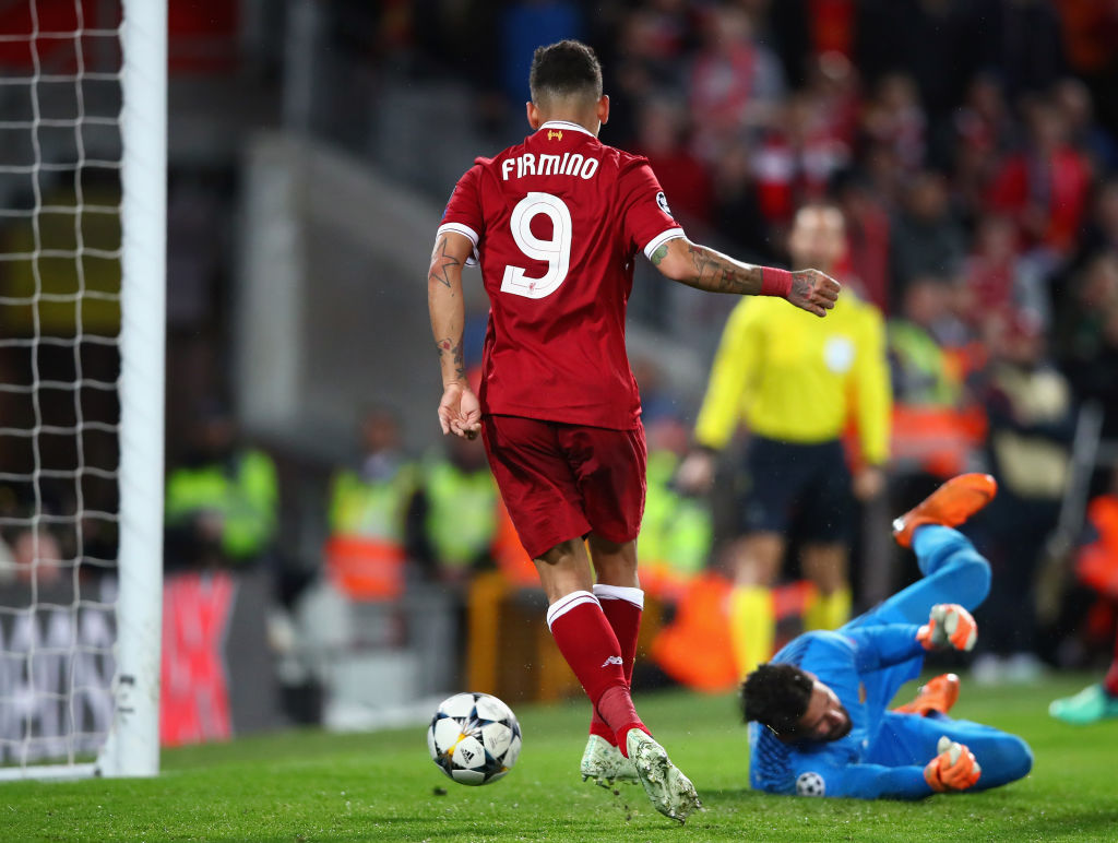 Liverpool's Roberto Firmino scores past Roma's Alisson Becker