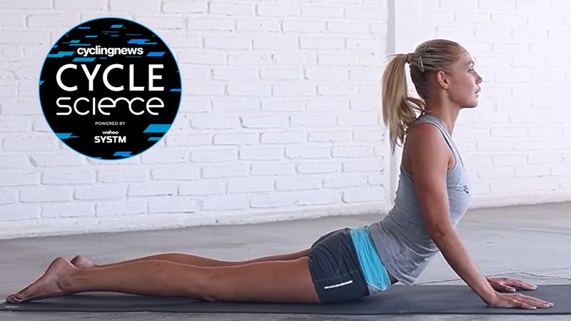 Yoga instructor performing a lumbar stretch