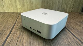 Beelink SER9 Mini PC on a wood background