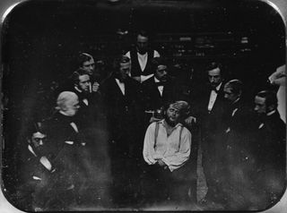 This image, a daguerreotype, taken in 1847 shows a team of doctors in Boston giving anesthesia to a man identified as Edward Gilbert Abbott by using a substance called ether.