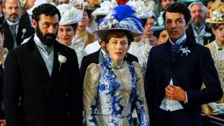 George, Bertha, and Larry stare stunned in a crowd