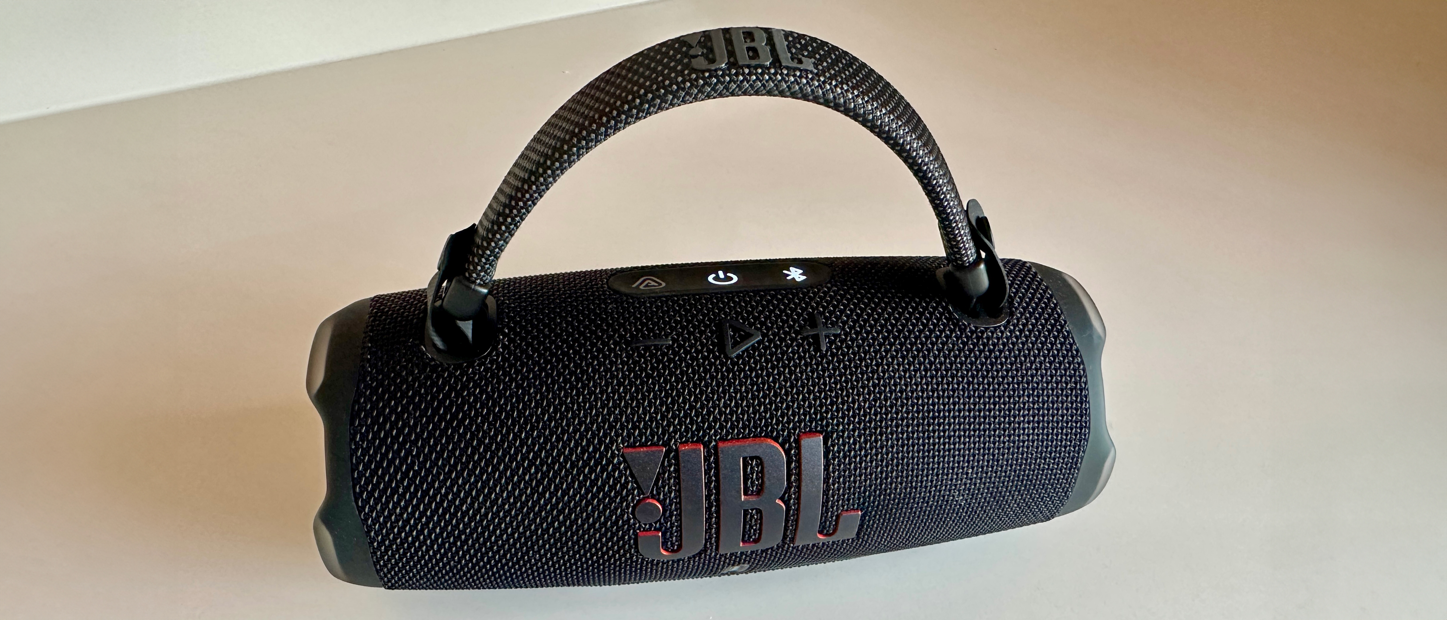 The JBL Charge 6 speaker in black on a white surface