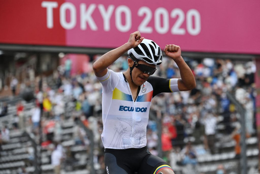 Ecuadors Richard Carapaz celebrates after crossing the finish line to win the mens cycling road race during the Tokyo 2020 Olympic Games at the Fuji International Speedway in Oyama Japan on July 24 2021 Photo by Greg Baker AFP Photo by GREG BAKERAFP via Getty Images
