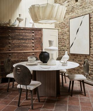 Quarry tiles in dining room with round table