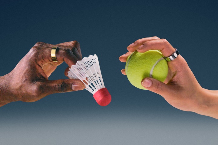 Models wearing the Oura Ring holding a tennis ball.