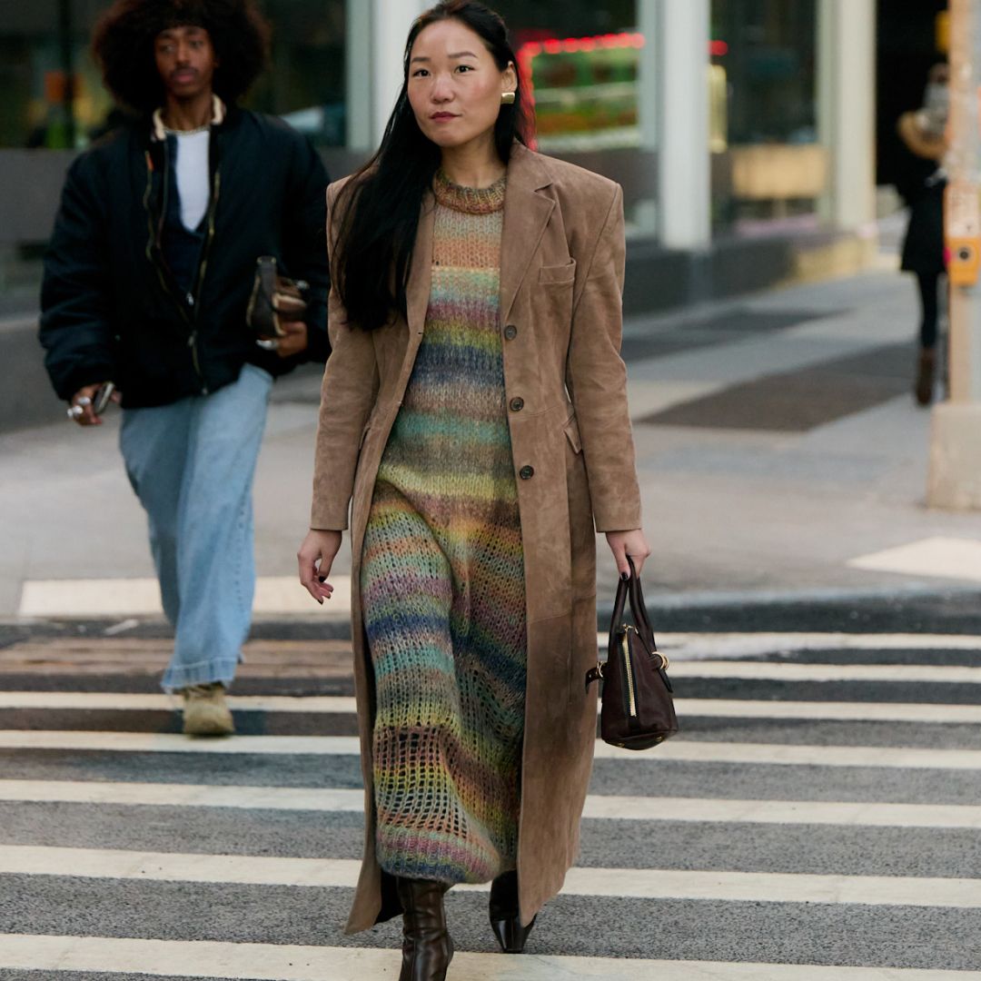 a woman wear a sweater dress on the streets of new york