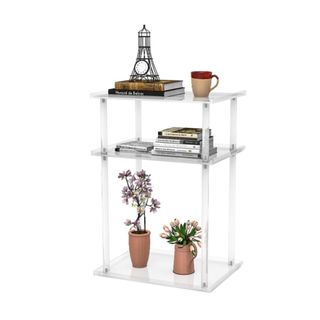 A three tier acrylic shelf with decor on it