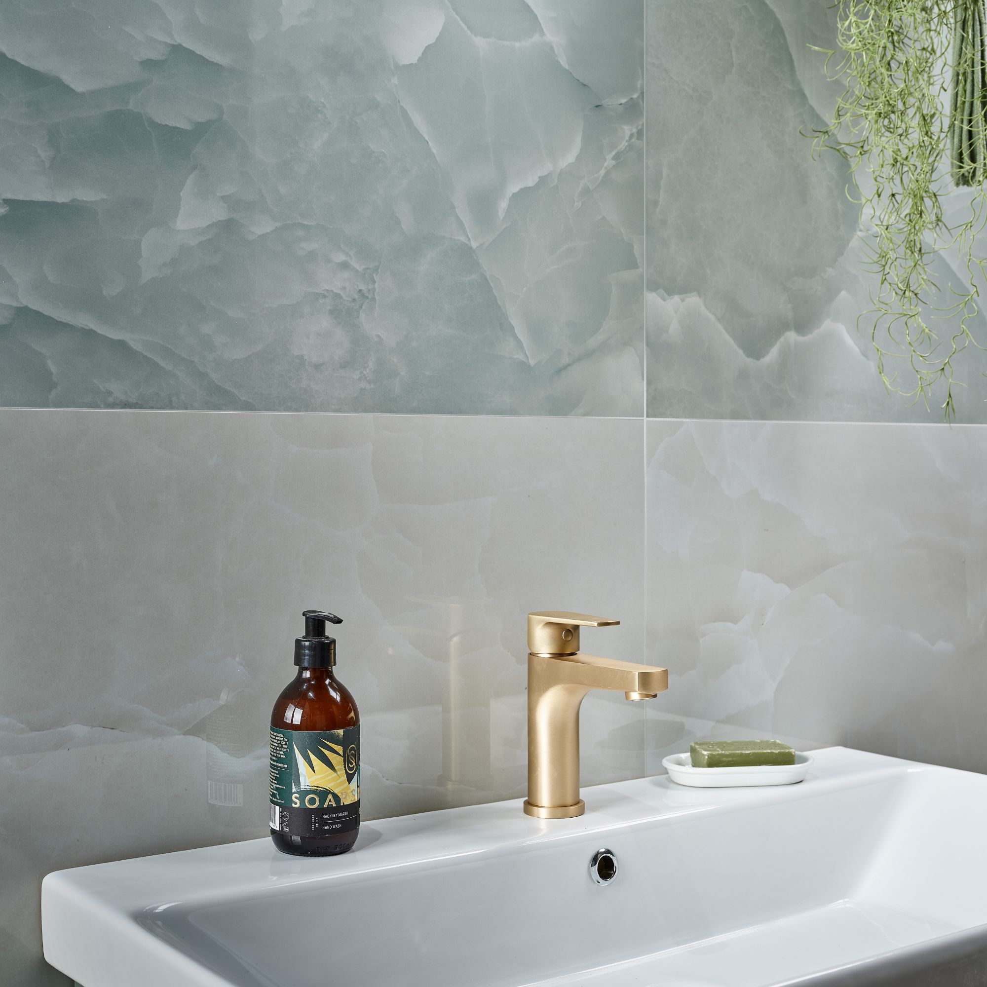 Grey and blue onyx tiles behind a bathroom sink