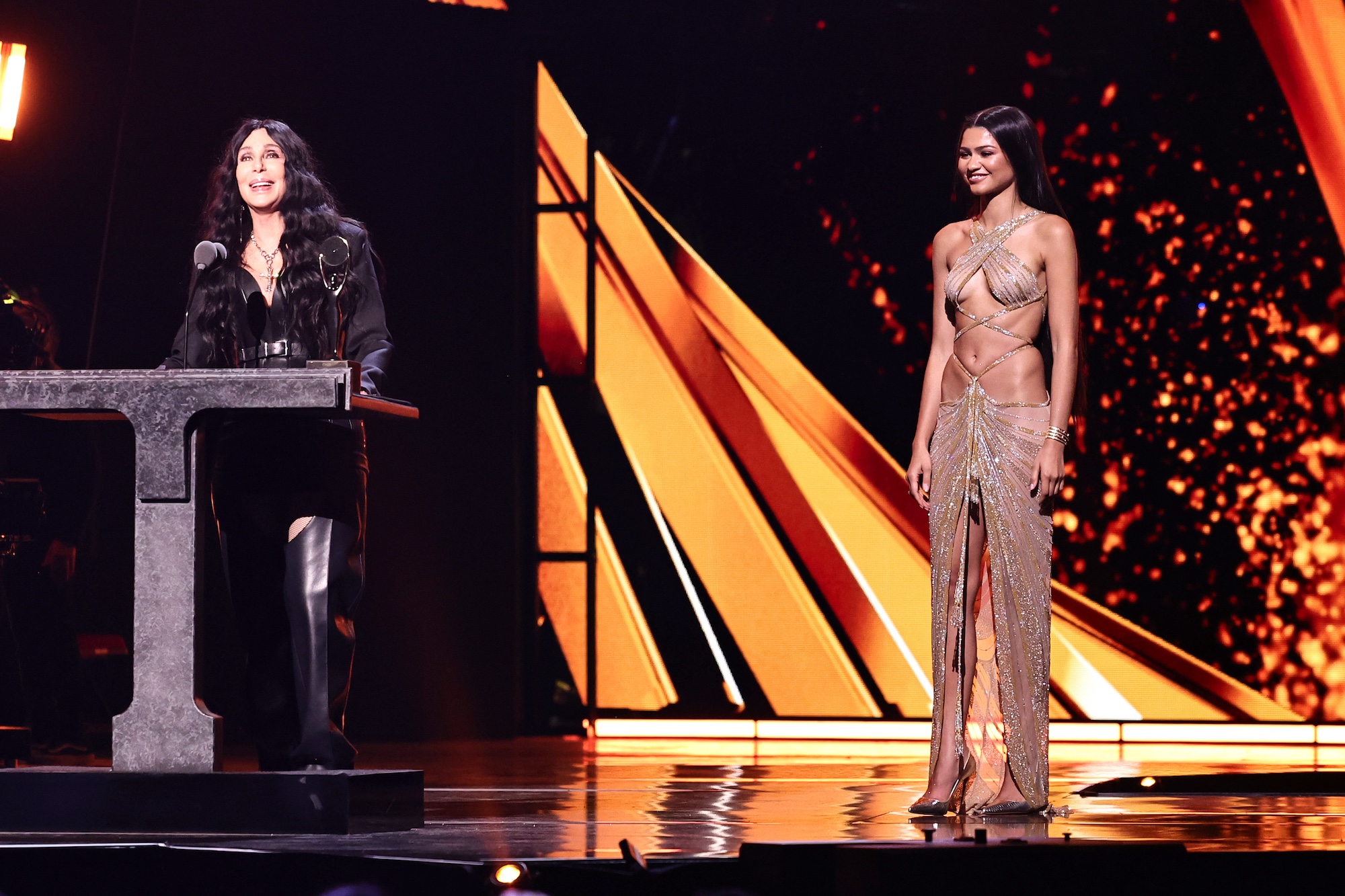 Zendaya smiling in a Mackie gown while honoring Cher.