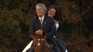 Julia Roberts and Richard Gere ride on a horse in Runaway Bride